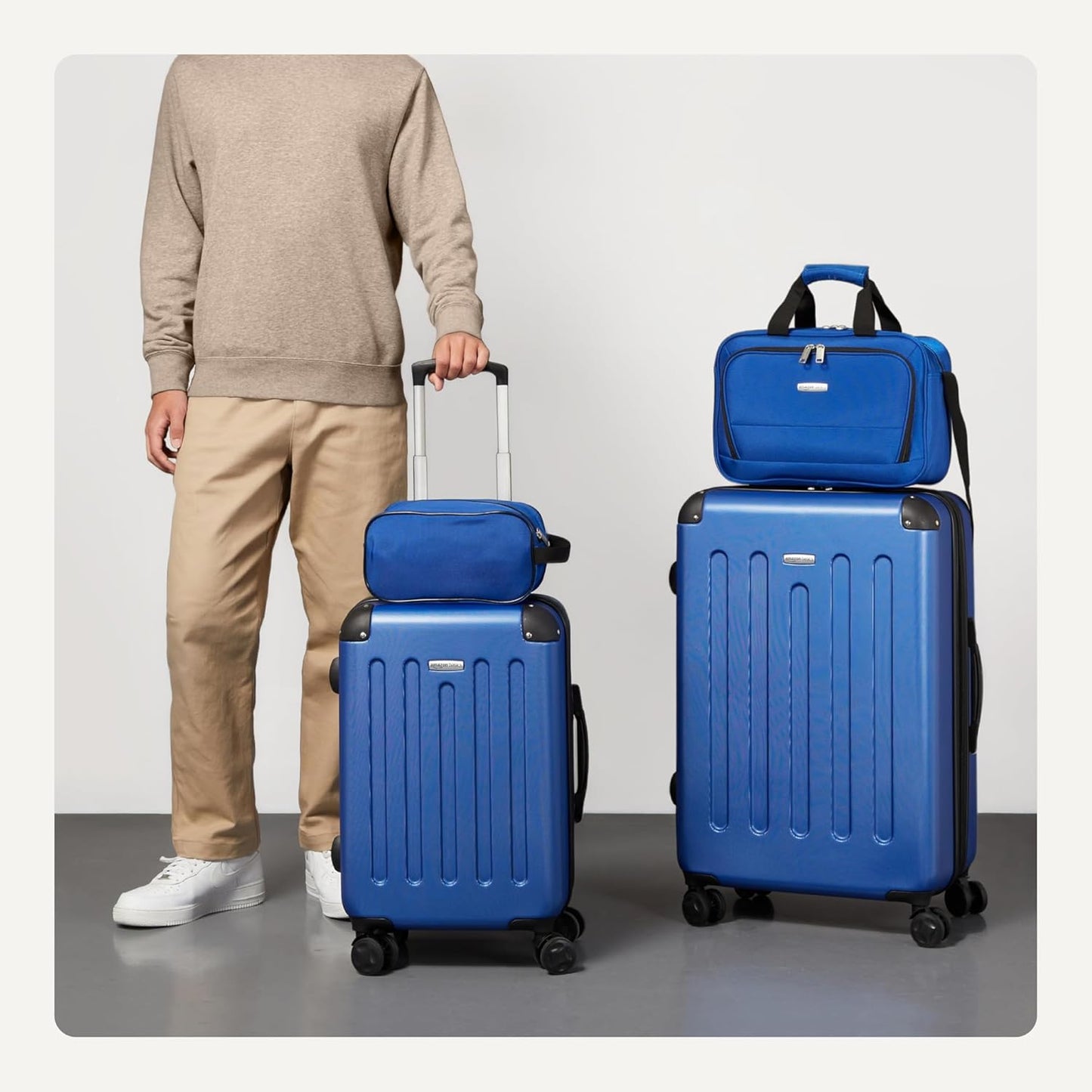 Amazon Basics 4-Piece Luggage Set, Including Two Hardside Suitcases With Multidirectional Spinner Wheels (22" Carry-On and 28" Checked), Plus 15-inch Tote Bag and 10-inch Compact Travel Bag, Navy Blue