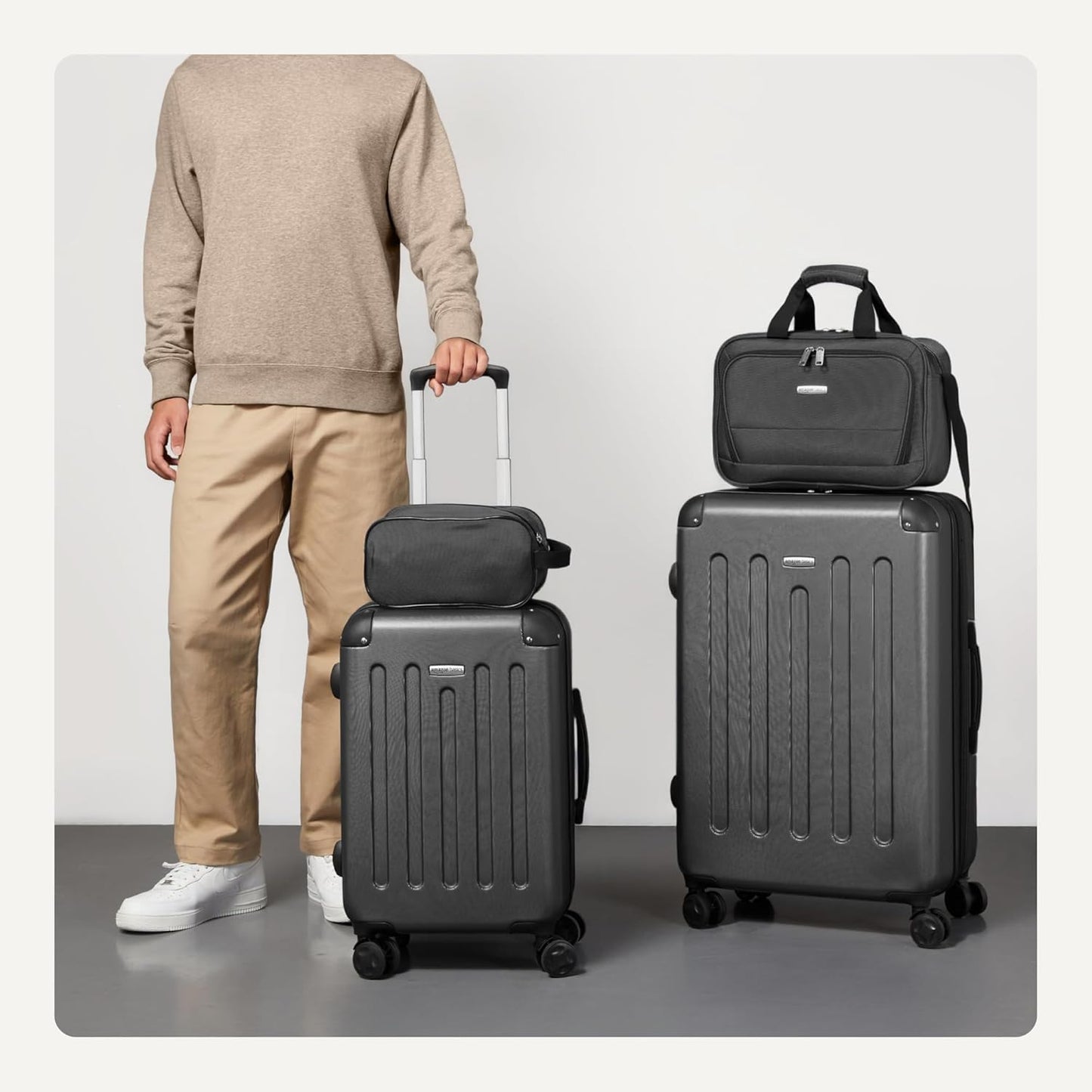 Amazon Basics 4-Piece Luggage Set, Including Two Hardside Suitcases With Multi-directional Spinner Wheels (22" Carry-On and 28" Checked), One 15-inch Tote Bag and One 10-inch Compact Travel Bag, Black