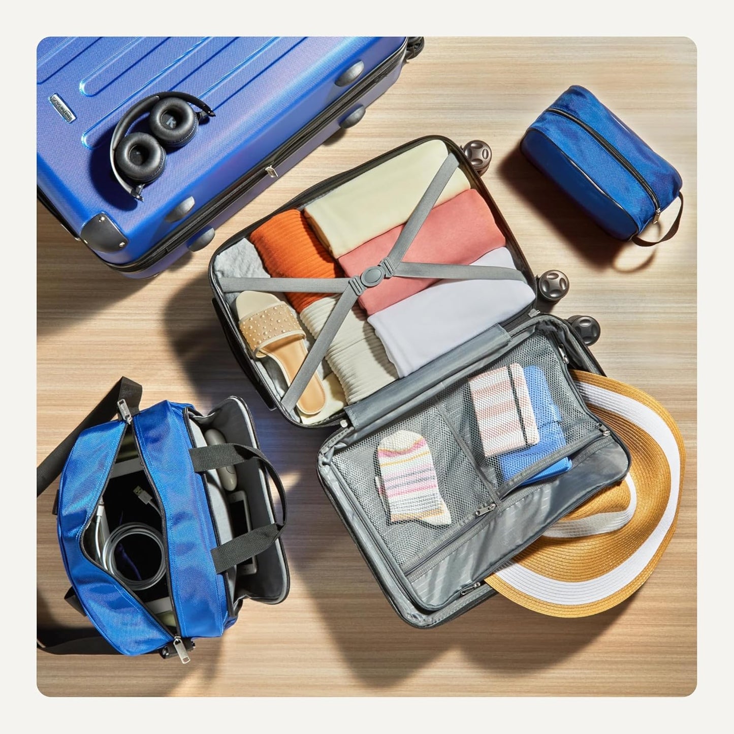 Amazon Basics 4-Piece Luggage Set, Including Two Hardside Suitcases With Multidirectional Spinner Wheels (22" Carry-On and 28" Checked), Plus 15-inch Tote Bag and 10-inch Compact Travel Bag, Navy Blue